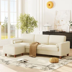 Bank 3-zits in kunstleer, met poef en 2 ronde kussens, houten frame, 234x155x88cm, Beige Bank 3-zits in kunstleer, met poef en 2 ronde kussens, houten frame, 234x155x88cm, Beige